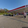 CPR in progress for adult male at gas station