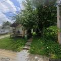 Downed power line behind Richardson Avenue home