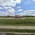 Officer checks gray pickup at Family Dollar