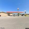 Dispute at gas station, blue pickup left area