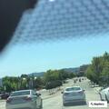 Stopped Honda sedan on freeway shoulder
