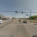 Man throwing objects at fire truck in roadway