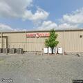 Officer checks silver car at Rupert Family Dollar