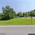 Vehicle fire near building involving propane tank