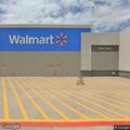 Person slumped over counter at Newburgh Walmart