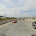 Two sedans on shoulder and Prius near off-ramp