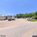 Car engulfed in flames at salvage yard driveway