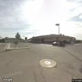 Person laying in middle lane waving arms on Highway 26