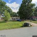 Person experiencing abdominal pain at White Oak Circle