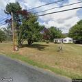 Person with abdominal pain at residence in Greenwood
