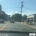 Person sleeping on sidewalk blocking path in Charlottesville