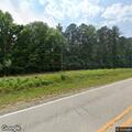 Minivan leaves roadway and enters woods on State Road 70