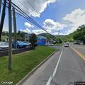 Coal truck reported forcing car off road near hospital
