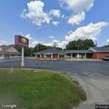 Traffic stop on blue Honda sedan at bank