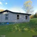 Person with flashlights at burned home reported