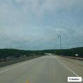 Male on toll bridge taking photos, no danger found