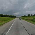 Man walking along Interstate 81 exit ramp