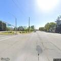 Person hitchhiking close to traffic on Lakeville Hwy