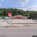 Female lying beside road at V Mart parking lot in Alum Creek