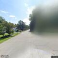 Suspicious car repeatedly drives past woman walking
