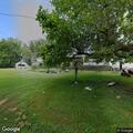 Suspicious person with flashlight near vehicle