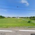 Man with neck pain and dizziness at highway address