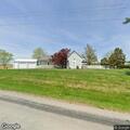 Dog reported left on roadway near residence