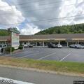 Man found unconscious in vehicle behind restaurant