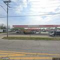 Man appearing intoxicated on bicycle at gas station