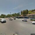 Loose Rottweiler wandering in roadway at highway