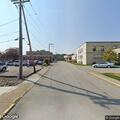 Officer escorts woman off Division Street property