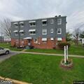 Person seen inside dumpster behind apartment