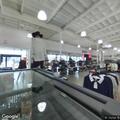 Man takes suit from store and leaves in blue Tesla
