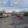 Vehicle with flashing lights in parking lot