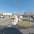 Woman outside business yelling about abuse claims