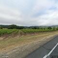 Pedestrian walking on fog line near Sonoma