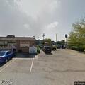Child riding bicycle in roadway at Speedway