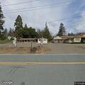 Disabled car on Highway 88 near hardware store