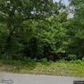 Illegal dumping of furniture and trash on hillside