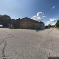 Man urinating on Family Dollar building
