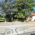 Person with difficulty breathing at bus stop on Santa Rosa Ave