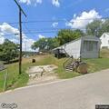Metal canopy blows onto power lines, power outage