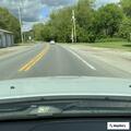 Car goes off roadway into ditch near school