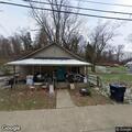 Woman reports being struck during fight in home