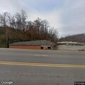 Intoxicated person stumbling near old Blockbuster