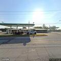Truck hits building and car at dealership, flees scene