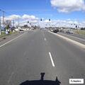 Wrong-way gray sedan stopped on Gerber center divide