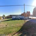Person with chest pain and breathing difficulty at home