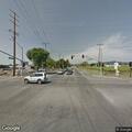 Passenger hanging from window of blue SUV