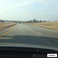 Reckless silver truck passing on highway shoulder